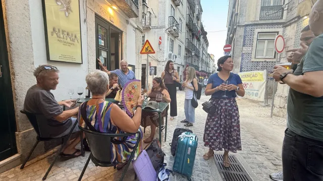 The group gathering outside a restaurant in a Lisbon side street