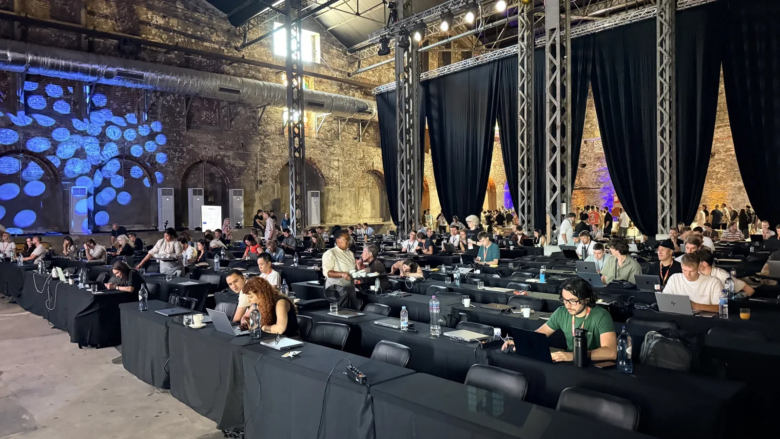 The main hall at LX Factory. One track, 300 specialists and a laptop on almost every desk.