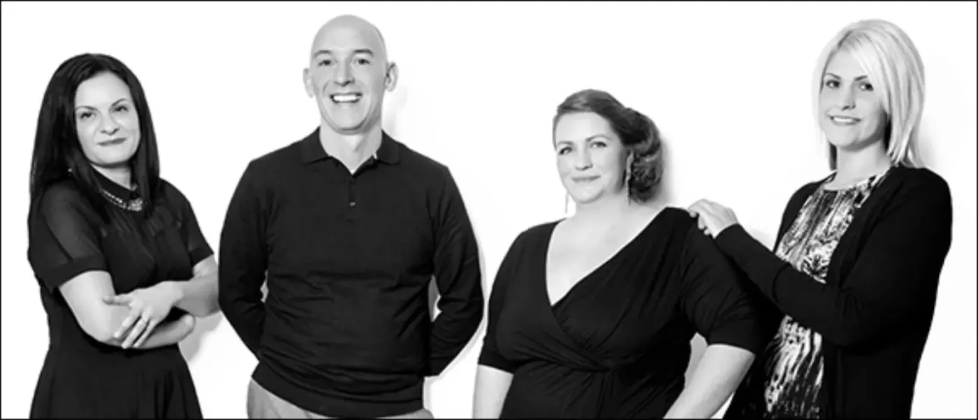 The Christie Paul Hair team photographed together in black and white