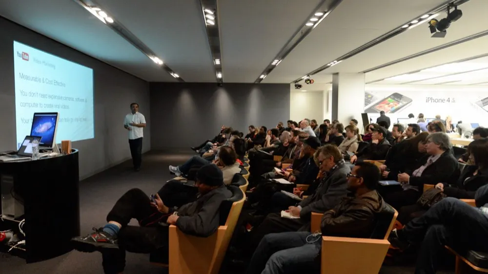 Uzair presenting to a full room at Apple's flagship store in London