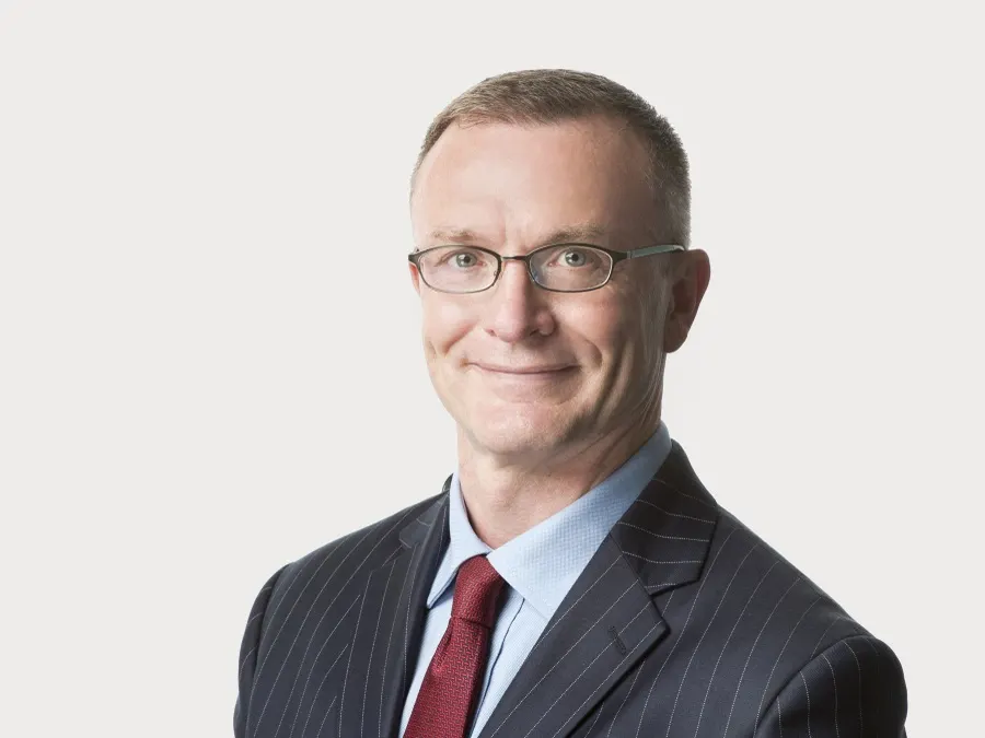 Team headshot photographed for Oliver Wyman