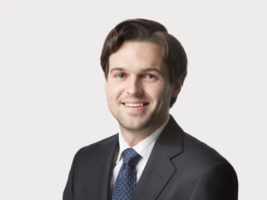 Team headshot photographed for Oliver Wyman
