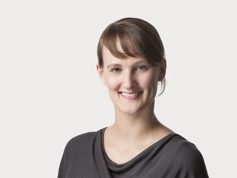 Team headshot photographed for Oliver Wyman