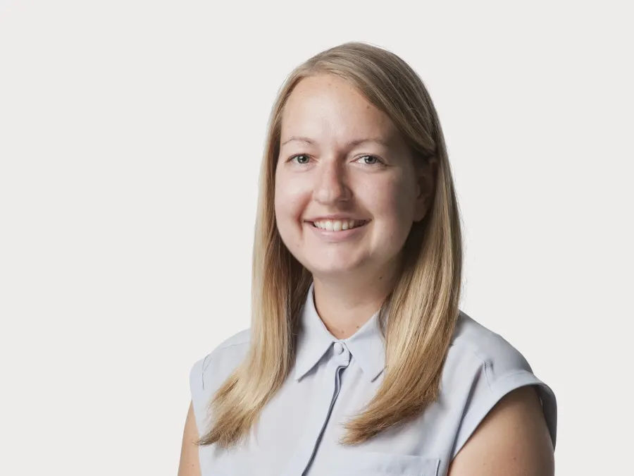 Team headshot photographed for Oliver Wyman